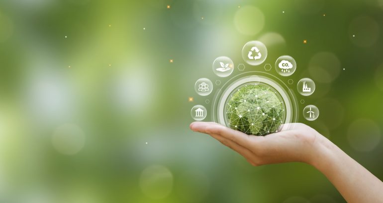 Hand of human holding green earth with the icon of Environment on green blur backgroud for ESG, co2, and net zero.World sustainable environment, save clean planet, Earth day and Ecology concept.